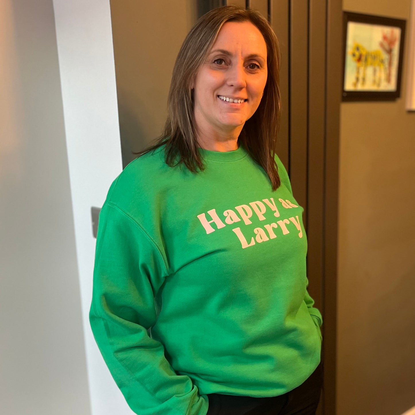 HAPPY AS LARRY SWEATSHIRT. Green with pink print.