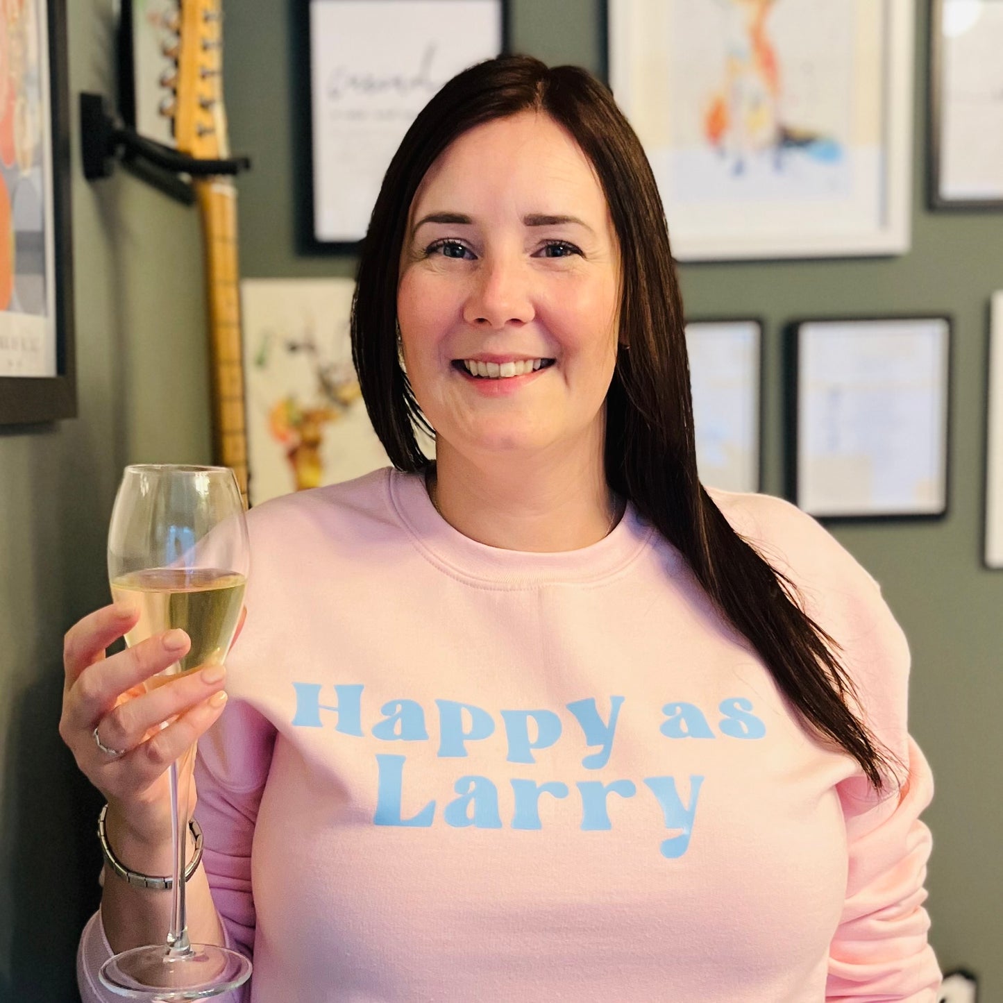 HAPPY AS LARRY SWEATSHIRT. Pink with blue print.