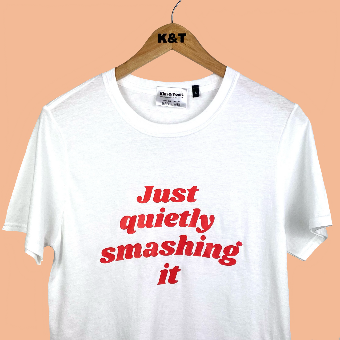 JUST QUIETLY SMASHING IT T-shirt. White with coral red print.