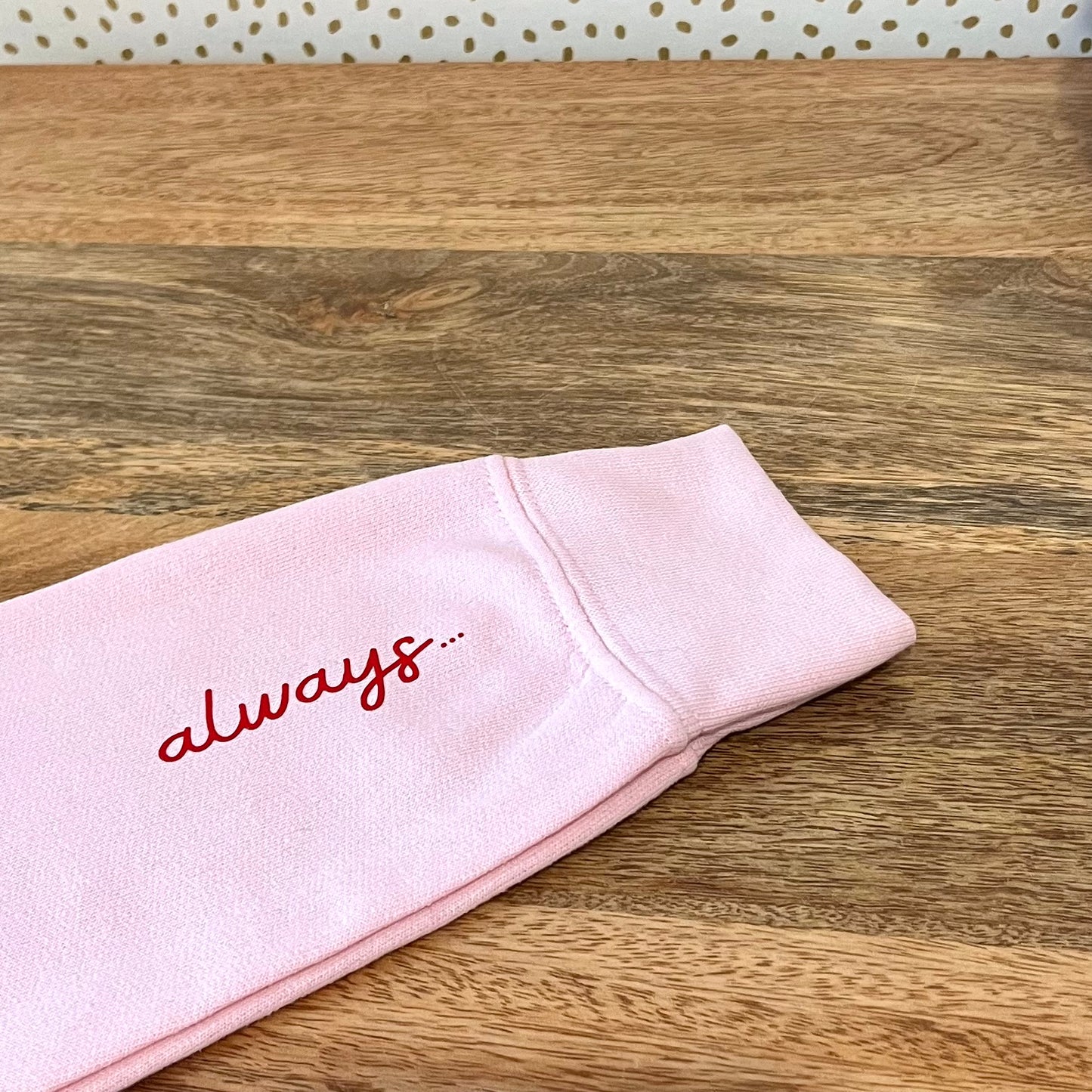 LOVE SWEATSHIRT. Pink with bright red print.