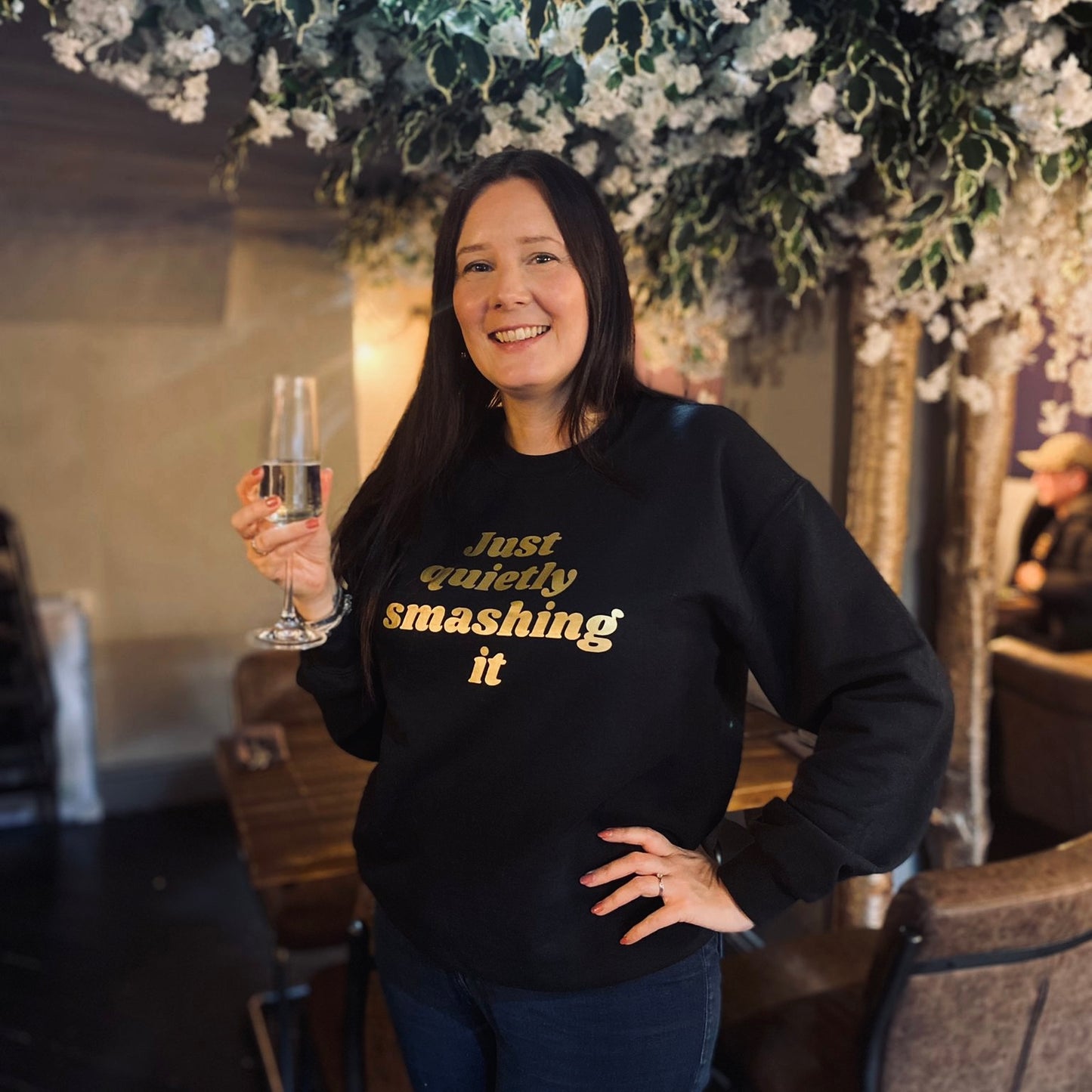 JUST QUIETLY SMASHING IT SWEATSHIRT. Black with gold print.