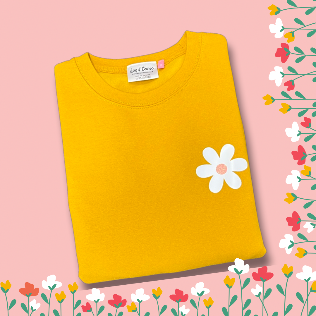 YELLOW DAISY SWEATSHIRT. With white and sparkly pink print.