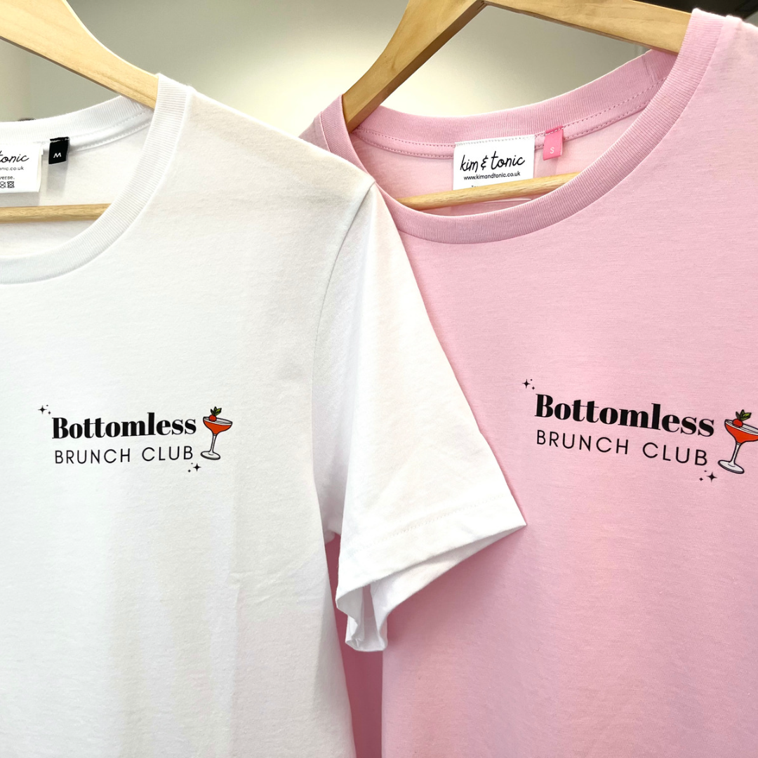 BOTTOMLESS BRUNCH CLUB. Pink with black print.