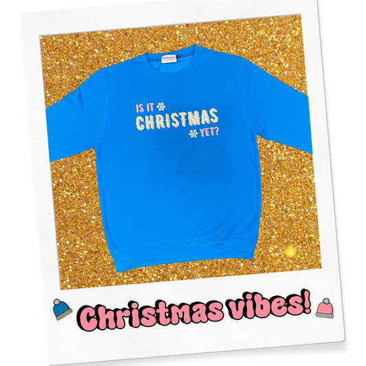 IS IT CHRISTMAS YET? Blue sweatshirt with glitter print.