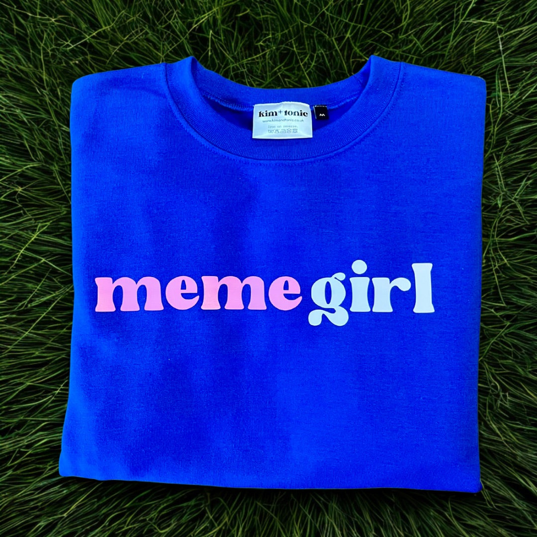 MEME GIRL SWEATSHIRT. Blue with white and pink print.