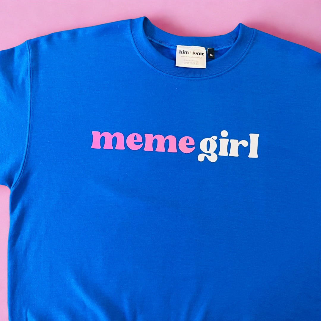 MEME GIRL SWEATSHIRT. Blue with white and pink print.