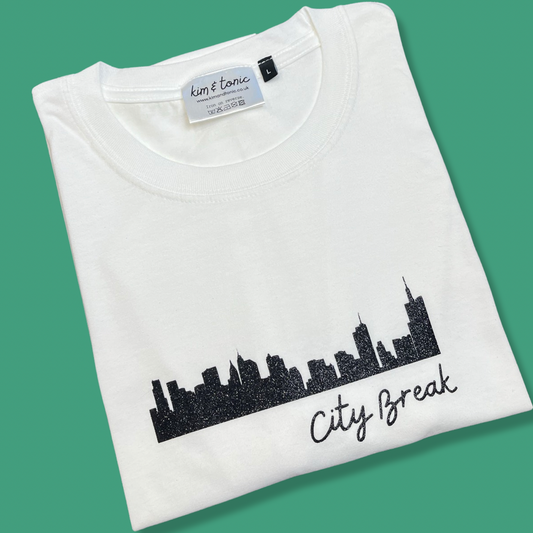 CITY BREAK T-SHIRT. White with sparkly black print.