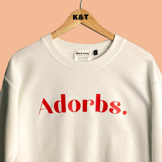 ADORBS SWEATSHIRT. White with red print.