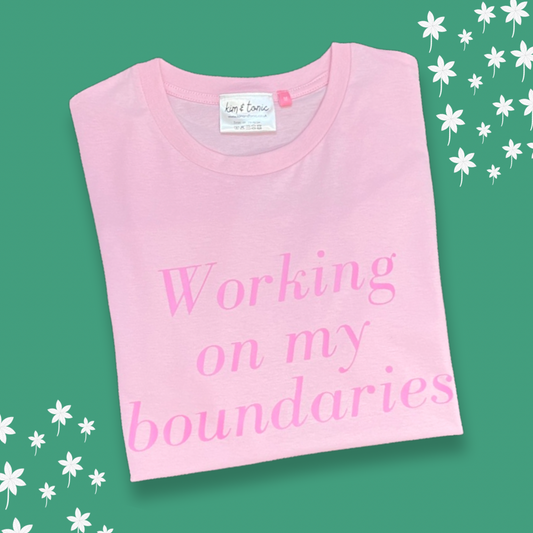 WORKING ON MY BOUNDARIES T-SHIRT. Light pink with pink print.
