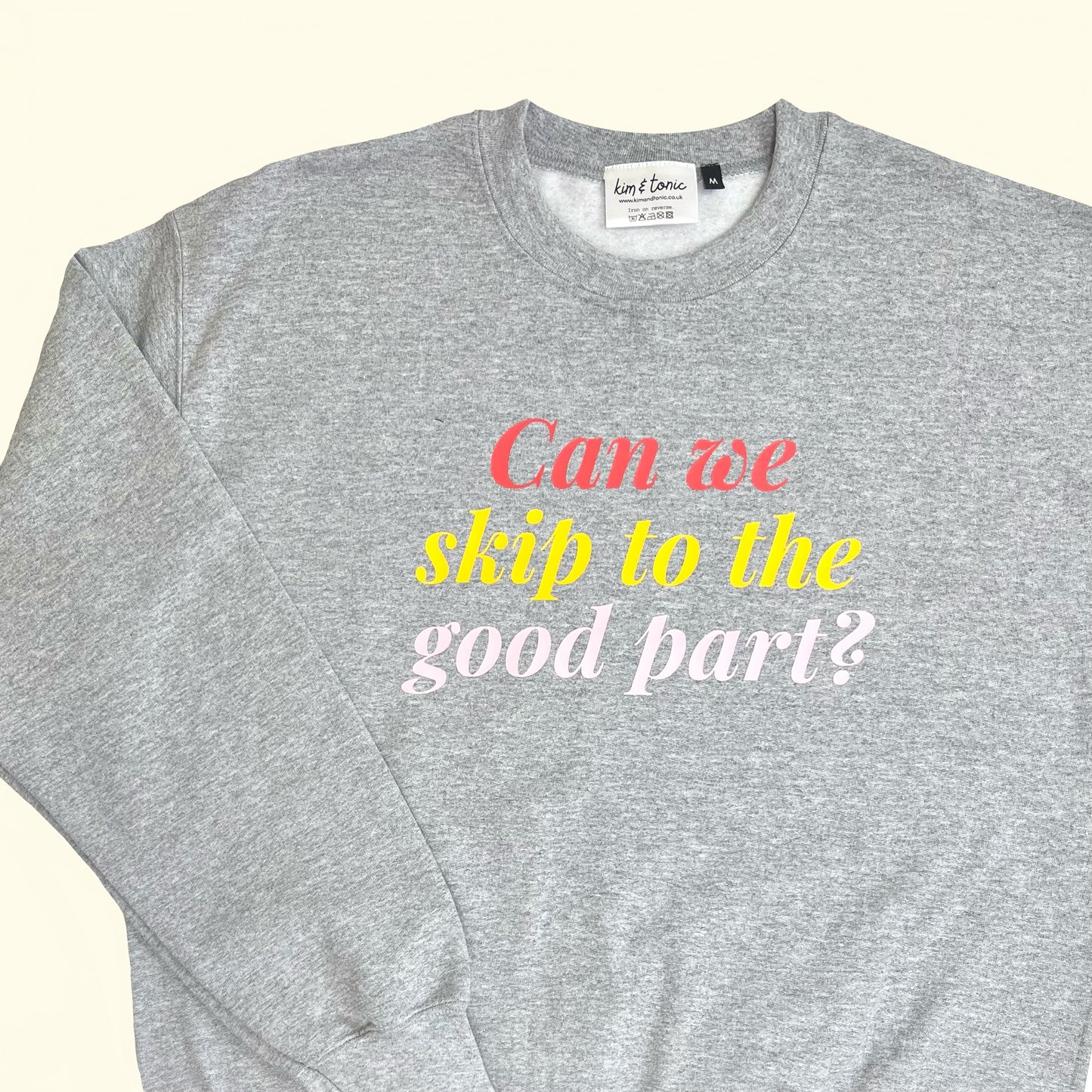 CAN WE SKIP TO THE GOOD PART? SWEATSHIRT. Grey with coral, mustard and pink print.
